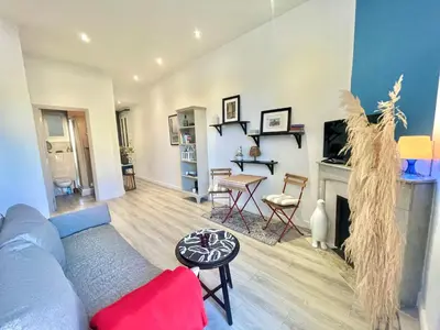 a living room with a couch and a fireplace at Casa Valfa à 200m du Palais, by Welcome to Cannes in Cannes
