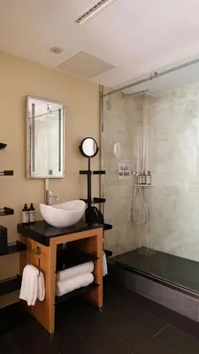 a bathroom with a sink and a shower at Five Seas by Inwood Hotels in Cannes
