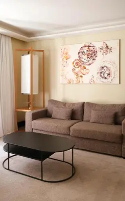 a living room with a couch and a coffee table at Five Seas by Inwood Hotels in Cannes