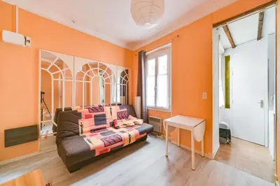 a living room with a couch and a table at IMMOGROOM- Close to the Palais des festivals- Wifi in Cannes