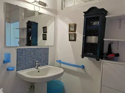 a bathroom with a sink and a mirror at Karol in Cannes