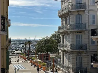 a building with balconies on the side of a street at Mark in Cannes