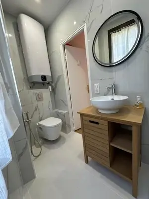 a bathroom with a sink and a mirror and a toilet at Mark in Cannes