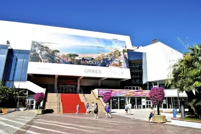 a group of people walking in front of a building at Welcoming Apartment with parking - Croisette in Cannes