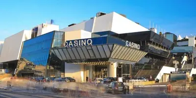 a parking lot in front of a large building at Welcoming Apartment with parking - Croisette in Cannes