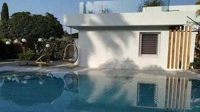a reflection of a house and a swimming pool at Villa roi Albert 1 in Cannes