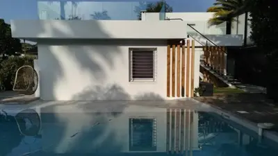 a reflection of a house in a swimming pool at Villa roi Albert 1 in Cannes