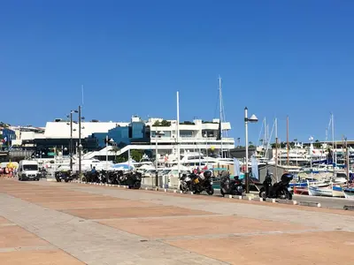a row of motorcycles parked next to a marina at Appartement moderne à Cannes, 45 m², proche des plages in Cannes