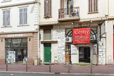 a group of store fronts on a city street at IMOOGROOM - Modern - City Center - AC - 9 min from the Palais in Cannes