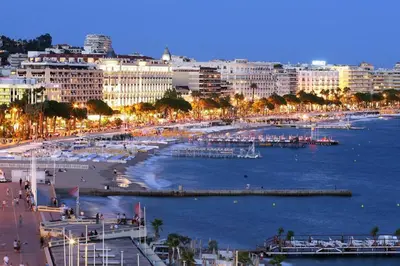 a city with a harbor with boats in the water at Grand Studio Carré d'Or - Les Méridiens in Cannes