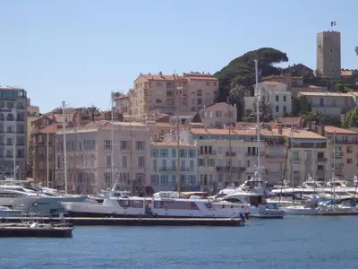 a group of boats docked in a harbor with buildings at Grand Studio Carré d'Or - Les Méridiens in Cannes