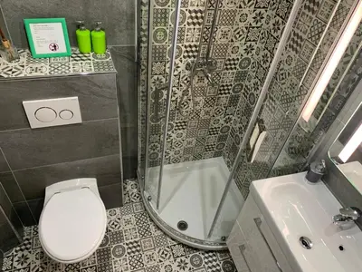 a bathroom with a shower and a toilet and a sink at Azur Studios Cannes in Cannes