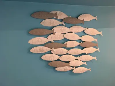 a group of fish on a blue wall at Azur Studios Cannes in Cannes