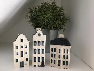 two white buildings sitting next to a potted plant at Azur Studios Cannes in Cannes