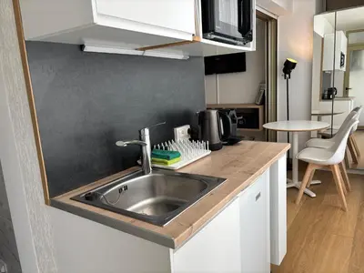 a kitchen with a sink and a counter top at Studio Cosy Pradignac in Cannes