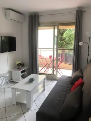 a living room with a couch and a table at Cannes center in Cannes