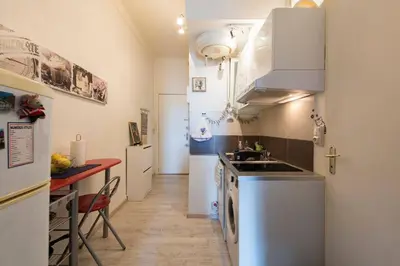a small kitchen with a sink and a counter at RIVIERA STUDIO CANNES CENTER in Cannes