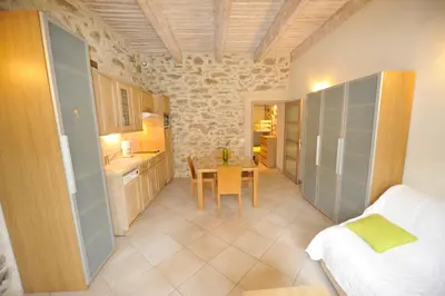 a living room with a couch and a table at La Bastide du Soleil in Cannes