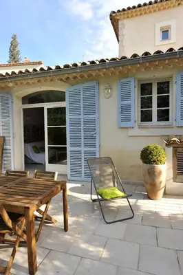 a room with a bed and a table and a staircase at La Bastide du Soleil in Cannes