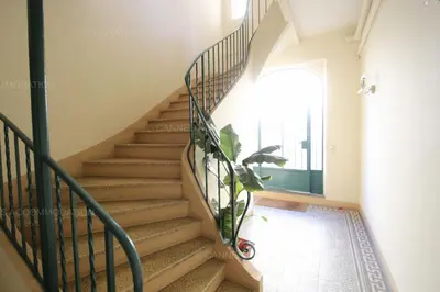 a staircase in a house with a plant at Blanc cel in Cannes