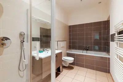 a bathroom with a toilet and a sink and a shower at Carrousel 4 in Cannes