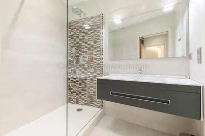 a bathroom with a sink and a shower at Clic 20 in Cannes
