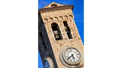 a tall tower with a clock on it at Feliz in Cannes