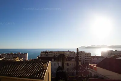 a view of the ocean from the roofs of buildings at Victoria in Cannes