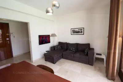 a living room with a couch and a table at Velapop in Cannes