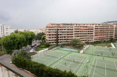 an aerial view of two tennis courts in a city at Velapop in Cannes