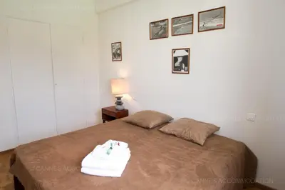 a bedroom with a bed with a white towel on it at Velapop in Cannes