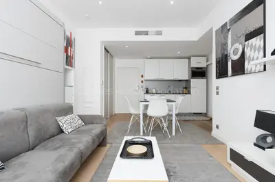 a living room with a couch and a table at Sparkle in Cannes