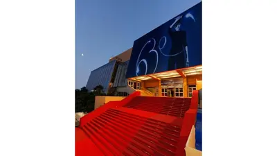 a red escalator in front of a building at Napoléon in Cannes