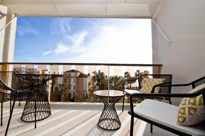 a balcony with chairs and a table on a balcony at Khayat in Cannes