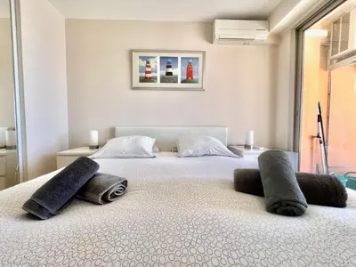 a bedroom with two beds with pillows on them at Acanthes by Welcome to Cannes in Cannes