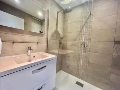 a bathroom with a sink and a shower at Acanthes by Welcome to Cannes in Cannes