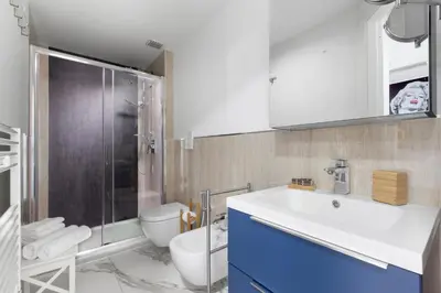 a bathroom with a sink and a shower and a toilet at Cannes Old Town Suites in Cannes