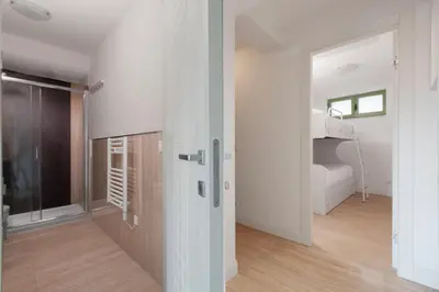 a room with a sliding door and a bedroom at Cannes Old Town Suites in Cannes
