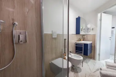 a bathroom with a toilet and a shower at Cannes Old Town Suites in Cannes