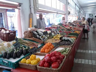 a market with lots of fruits and vegetables on display at Festival Apartment in Cannes