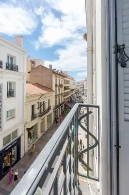 a view from a balcony of a city street at Cosy apartment 27 m2 in rue d'Antibes and Croisette in Cannes
