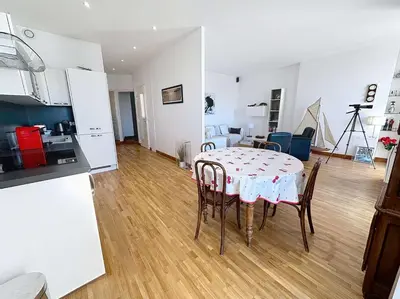 a kitchen and dining room with a table and chairs at Luxury 1 bedroom Quai St Pierre 2 mins from the Palais & Croisette 269 in Cannes