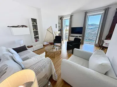 a living room with two white couches and a tv at Luxury 1 bedroom Quai St Pierre 2 mins from the Palais & Croisette 269 in Cannes