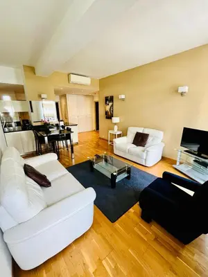 a living room with two white couches and a table at Golden Triangle 2Br/2Ba in Cannes
