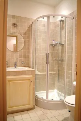 a bathroom with a shower and a sink and a toilet at Golden Triangle 2Br/2Ba in Cannes
