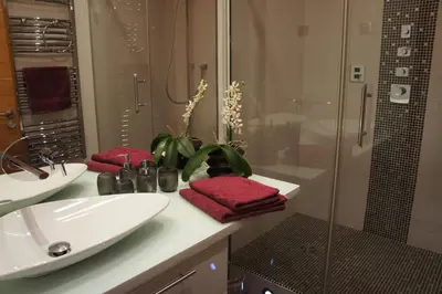 a bedroom with a bed and a dresser at Sea view Penthouse with terrace in Cannes