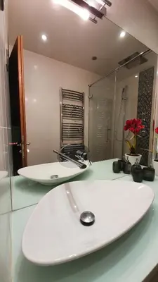 two surfboards sitting on a counter in a bathroom at Sea view Penthouse with terrace in Cannes