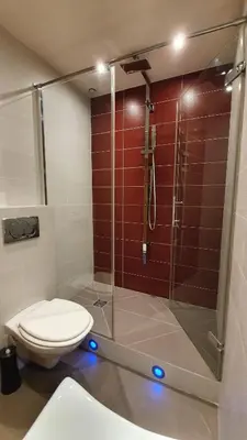 a bathroom with a toilet and a glass shower at Sea view Penthouse with terrace in Cannes