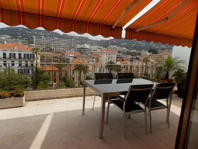 a table and chairs on a balcony with a view at Cannes Satellite in Cannes