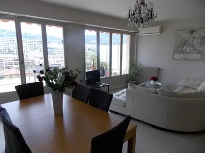 a living room with a table and a couch at Cannes Satellite in Cannes